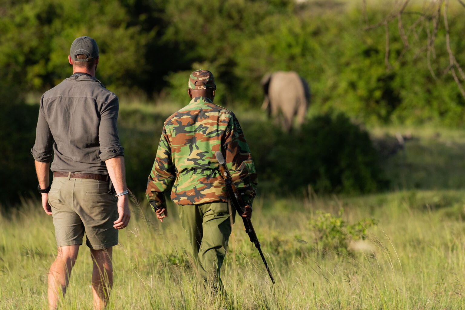 Guide leading a walking safari in Kenya